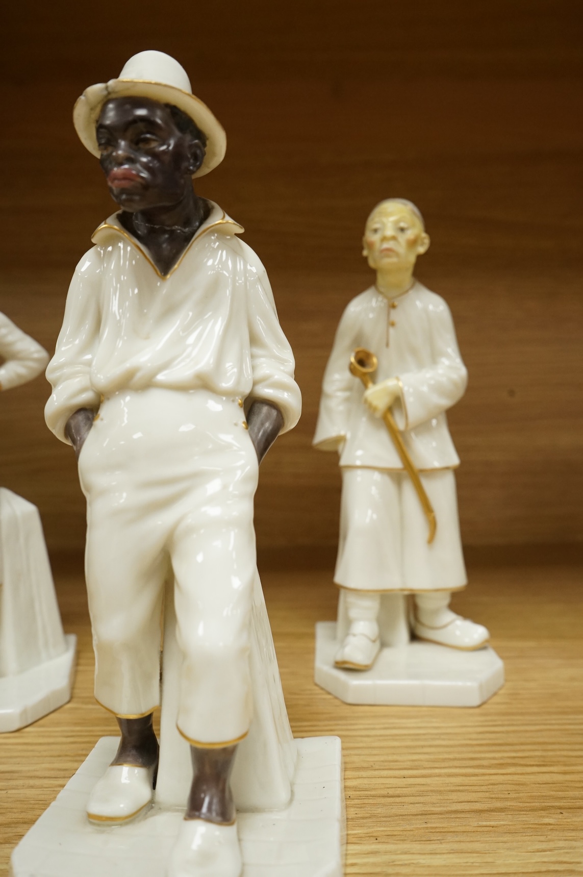 Four Royal Worcester figures from the Countries of the World Series to include Hindu and Chinaman, largest 18cm high